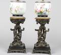 A Pair of Cast Metal and Porcelain Lamps