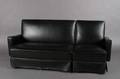 A Black Leather Upholstered Sectional Sofa