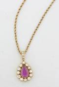 A Ladys 18 Karat Yellow Gold Diamond Blue Sapphire and Synthetic Ruby Reversible Pendant