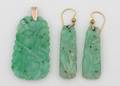 A Ladys Pair of Yellow Gold and Carved Medium Green Jadeite Earrings