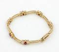 A Ladys 14 Karat Yellow Gold Ruby and Diamond Bracelet
