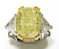 A Ladys Platinum and 18 Karat Yellow Gold and Fancy Yellow Diamond Ring