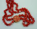 A Ladys Graduated Double Strand Salmon Coral Pearl Necklace