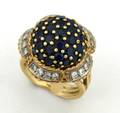 A Ladys Yellow Gold Blue Sapphire and Diamond Ring
