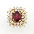 A Ladys Yellow Gold Diamond and Rhodolite Garnet Ring