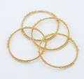 A Group of Four 22 Karat Yellow Gold Bangle Bracelets