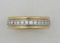 A Ladys 18 Karat Yellow Gold Platinum and Diamond Eternity Ring