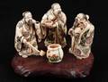 162 GROUP OF THREE CARVED IVORY FIGURES
