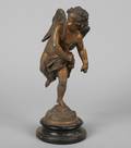 A Gilt Metal Figure of a Putto