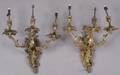 A Pair of Gilt Metal ThreeLight Louis XV Style Wall Sconces