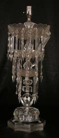 A Three Tier Cut Glass Lamp Hung with Prisms