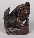 A Chinese Carved Wood Foo Dog