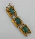 A Ladys High Karat Yellow Gold and Jadeite Bracelet