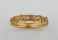 A Ladys 18 Karat Yellow Gold and Diamond Hinged Bangle Bracelet