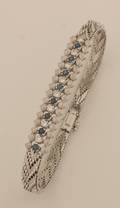 A Ladys 14 Karat White Gold Diamond and Blue Sapphire Bracelet