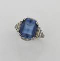 A Ladys Platinum Diamond and Synthetic Blue Sapphire Ring