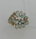 A Ladys 14 Karat Yellow Gold Diamond and Opal Ring