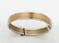 A Ladys 18 Karat Yellow Gold Bangle Bracelet MAUBOUSSIN