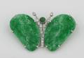 A Ladys Platinum Diamond and Carved Jadeite Brooch