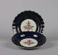 A Pair of Dr Wall Period Worcester Blue Ground and ParcelGilt Plates