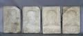 A Group of Four Carved Stone Plaques