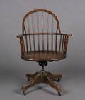 A Stickley Brothers Oak Rolling Desk Chair