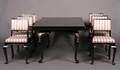 A Black Lacquer Dining Table and Six Side Chairs