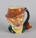A Staffordshire Figural Mug