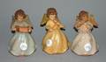 A Group of Three Carved Angel Music Boxes