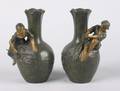 A Pair of Victorian Patinated Metal Vases