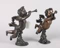 A Pair of Contemporary Patinated Bronze Figural Candlesticks