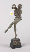 An Art Deco Style Metal Figure of a Dancer with a Marionette