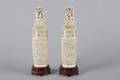 A Pair of Chinese Carved Bone Vases and Covers