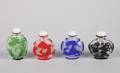 A Group of Five Peking Style Glass Snuff Bottles