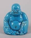 A Chinese Turquoise Glazed Ceramic Figure of Budai