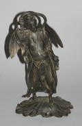 A Patinated Metal Asian Figure