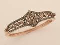 A Ladys SilverTopped Rose Gold and Diamond Hinged Bangle Bracelet