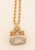 A Yellow Gold and Foil Backed Rock Crystal Seal Suspended from a 14 Karat Yellow Gold Rope Chain