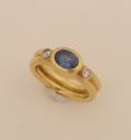 A Ladys 18 Karat Yellow Gold Blue Sapphire and Diamond Ring
