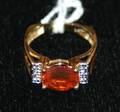 A Ladys 18 Karat Yellow Gold Fire Opal and Diamond Ring