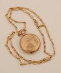 A Ladys 14 Karat Yellow Gold Pocketwatch Elgin
