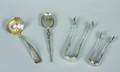 A Group of Two Silver Spoons and Two Silver Tongs