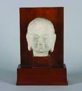 A Chinese Carved Limestone Head of a Buddha