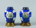 A Pair of Chinese Powder Blue and Famille Verte Porcelain Ginger Jars with Covers