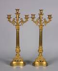A Pair of Gilt Metal Empire Style FourLight Candelabra