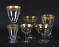 A Partial Set of Gilt Decorated Stemware