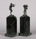 A Pair of Patinated Metal Figural Bookends