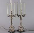 A Pair of Silvered Metal Five Light Candelabra