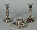 A Pair of Silver Plate Candlesticks