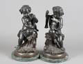 197 PAIR OF PATINATED BRONZE PUTTI